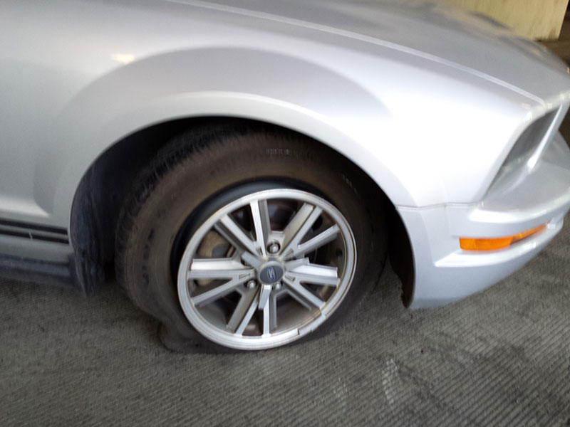 Flat tire mustang car
